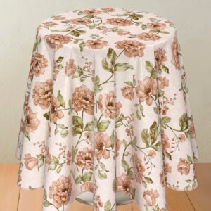 A round table covered with a wipe clean tablecloth featuring a floral design with brown peonies and green leaves on a light beige background