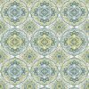 green multi wipe clean tablecloth design features intricate, symmetrical motifs in shades of green, grey, and yellow. The patterns resemble traditional or vintage tile designs, with repetitive geometric shapes and floral elements